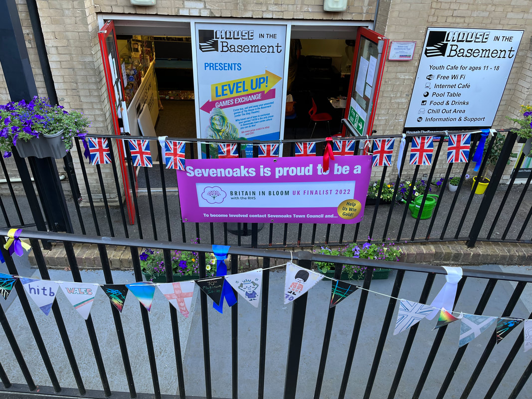 The Accessibility ramp outside of House in the Basement all decorated for Her Majesty the Queens Jubilee and Britain in Bloom in 2022.  